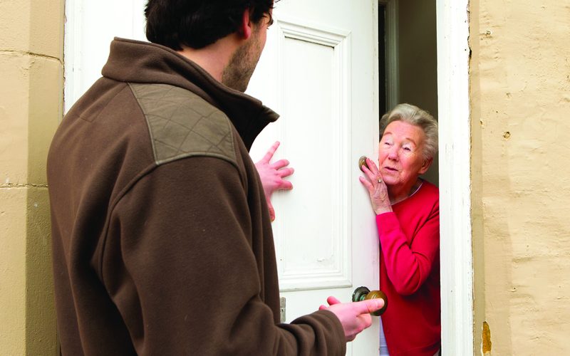 A trader calling at a front door